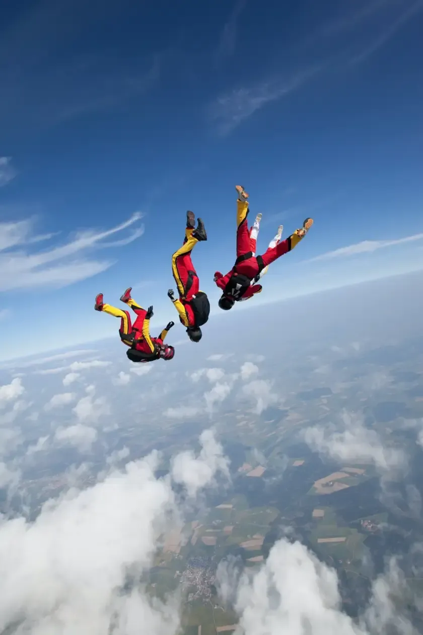 Tandem skydiver in freefall high above the Pattaya coastline