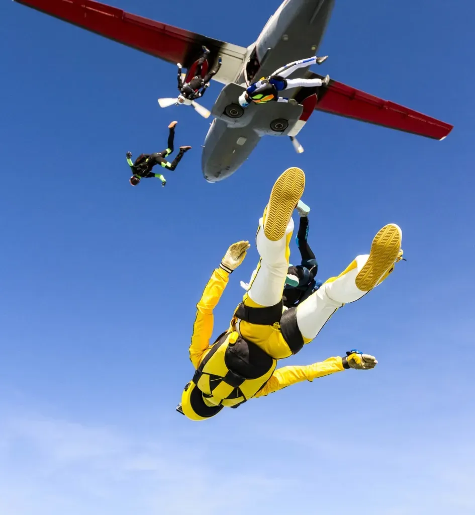 A group of jumpers leaving the aircraft door one after another